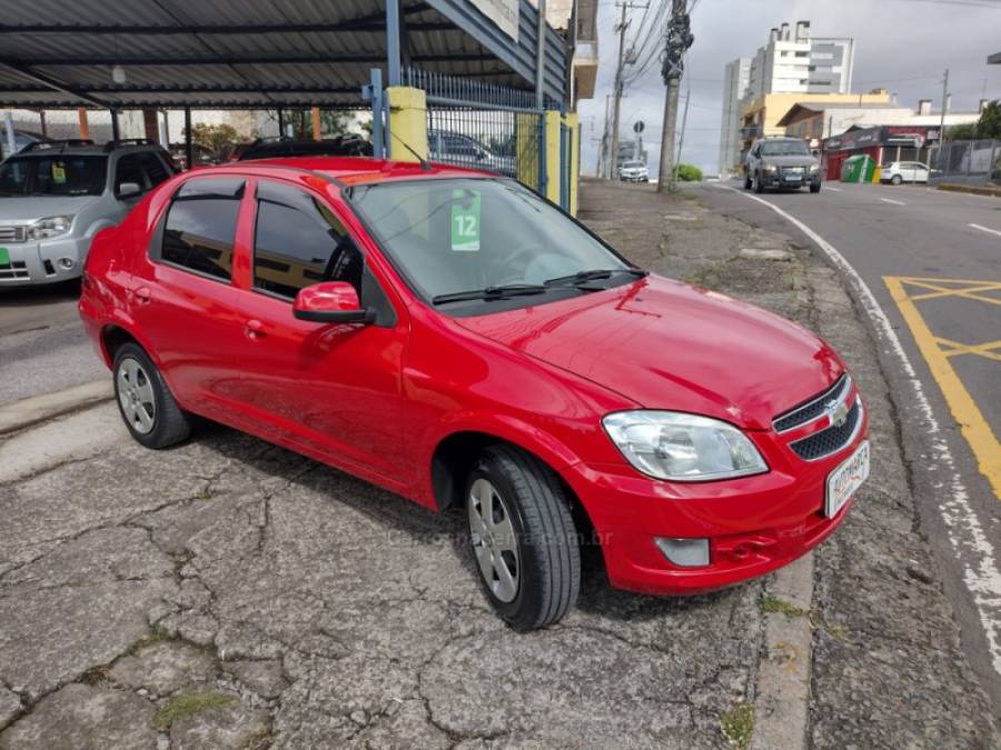 CHEVROLET - PRISMA - 2012/2012 - Vermelha - R$ 34.000,00